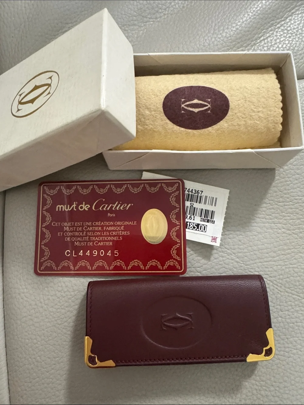 Cartier Burgundy Leather Key Holder with Gold Accents.
